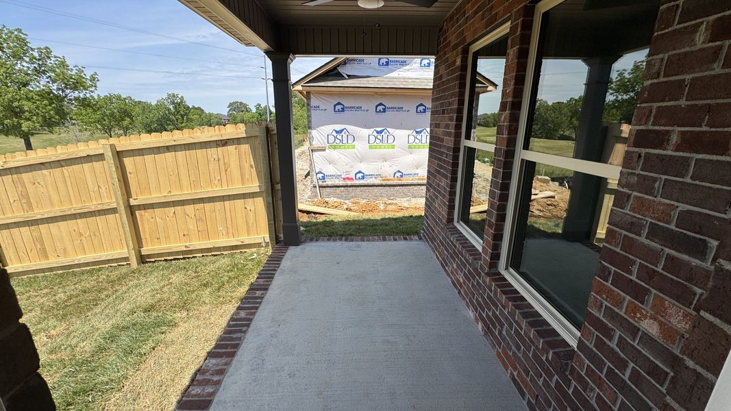 Exterior details and patio area of a home in The Greens at Legacy Townhomes, Springfield (Image 3).