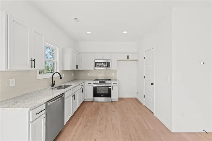 Furnished interior view inside a new home in , Carrollton (Image 4).