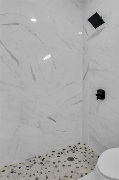 Bathroom with a marble finish shower Bathroom with a marble finish shower