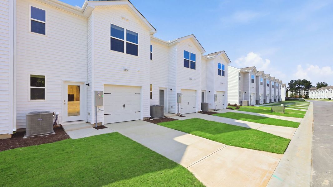 Front exterior of a new home in Clock Road Townhomes, New Bern, NC, highlighting curb appeal (Image 22).