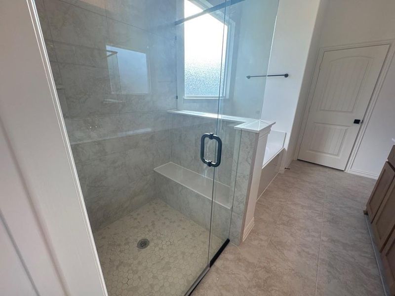 Bathroom with a bath, a stall shower, and vanity Bathroom with a bath, a stall shower, and vanity