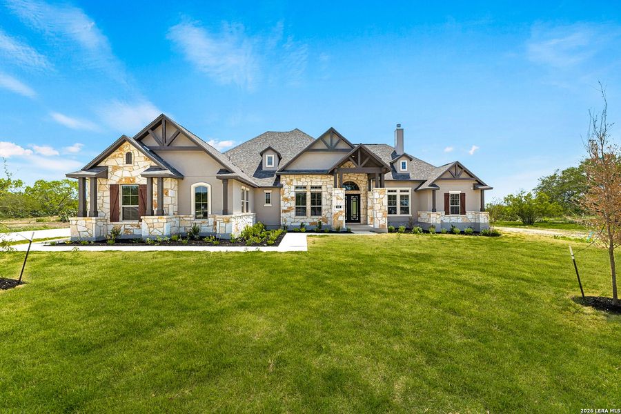 Front exterior of a new home in Legend Park, Castroville, TX, highlighting curb appeal (Image 2).