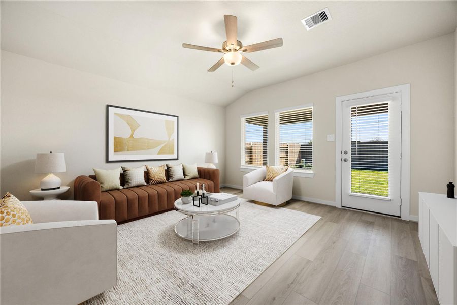 This bright and airy living room features large windows that fill the space with natural light, sleek flooring, and a neutral color palette, creating the perfect setting for relaxing or gathering with loved ones.