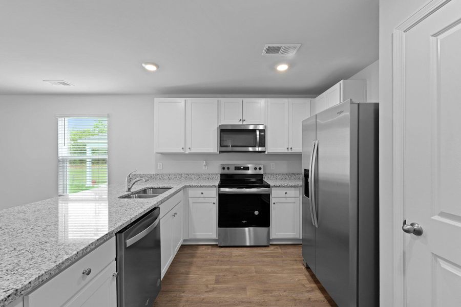 Furnished interior view inside a new home in Pine Hills at Cane Bay, Summerville (Image 3). Furnished interior view inside a new home in Pine Hills at Cane Bay, Summerville (Image 3).