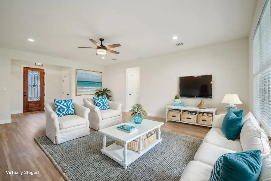 Virtually Staged Living room with visible vents, wood finished floors, recessed lighting, baseboards, and ceiling fan