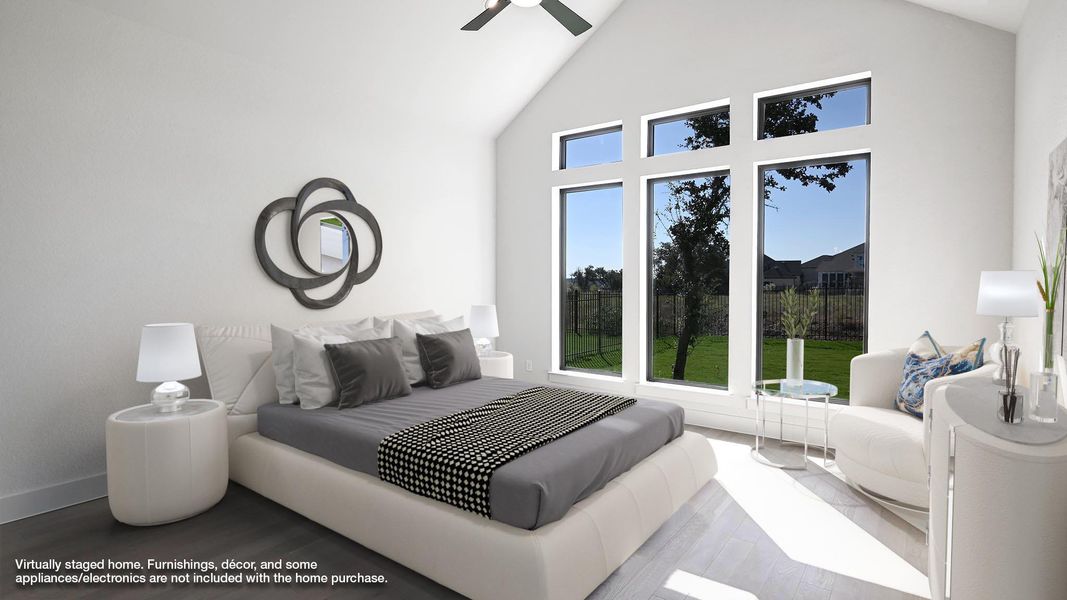Bedroom featuring high vaulted ceiling, wood finished floors, and a ceiling fan