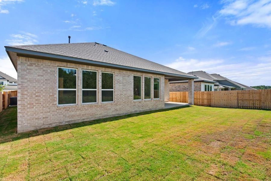 Front exterior of a new home in Capitol Collection at Lariat, Liberty Hill, TX, highlighting curb appeal (Image 22). Front exterior of a new home in Capitol Collection at Lariat, Liberty Hill, TX, highlighting curb appeal (Image 22).
