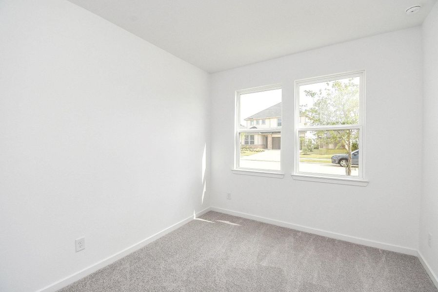 BEDROOM 2 IS LOCATED AT THE FRONT OF THE HOUSE AND OVERLOOKS THE FRONT YAR