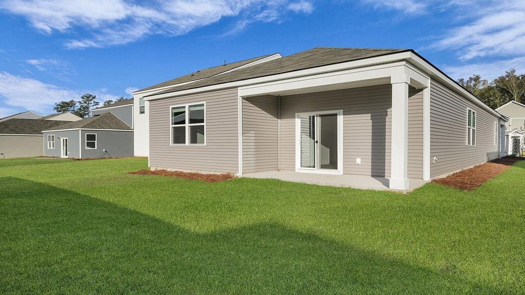 Exterior details and patio area of a home in Pine Hills at Cane Bay, Summerville (Image 3). Exterior details and patio area of a home in Pine Hills at Cane Bay, Summerville (Image 3).