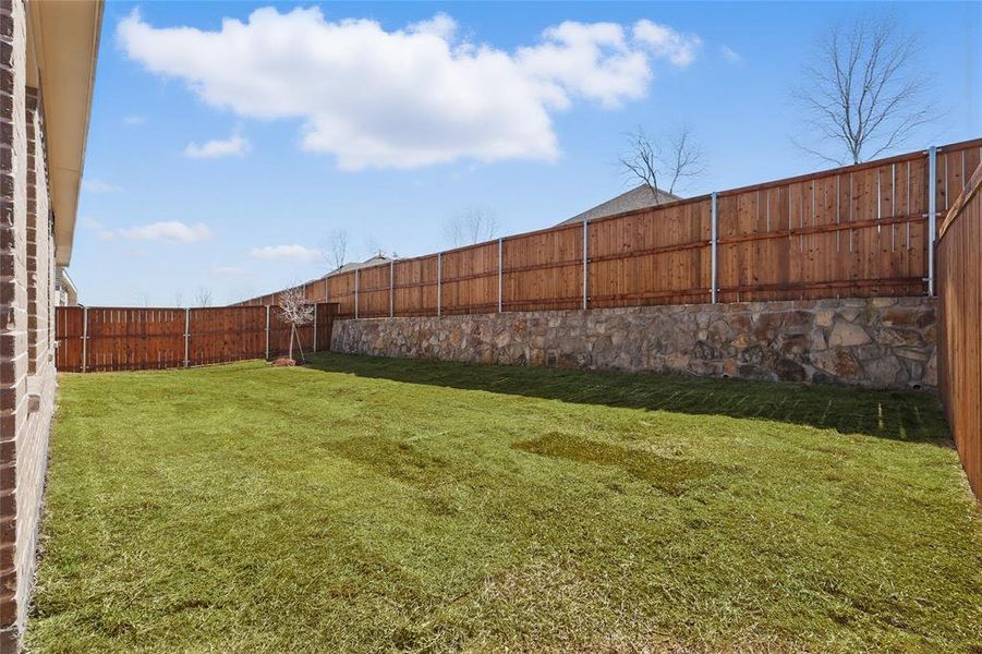 View of yard featuring a fenced backyard