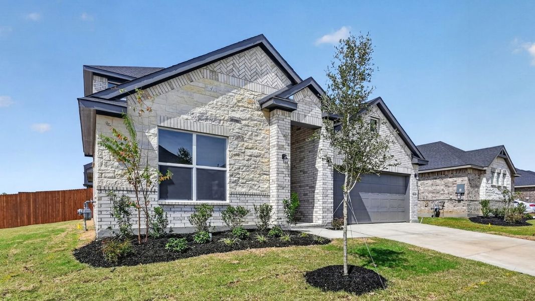 Representative exterior photo of a completed home built from the The Aspen by D.R. Horton in Lakeview Pointe, Midlothian, TX (Image 20).