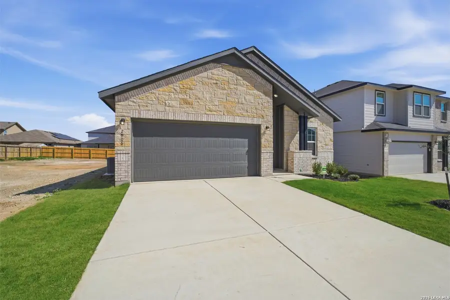 Front exterior of a new home in Laurel Vistas, San Antonio, TX, highlighting curb appeal (Image 2). Front exterior of a new home in Laurel Vistas, San Antonio, TX, highlighting curb appeal (Image 2).