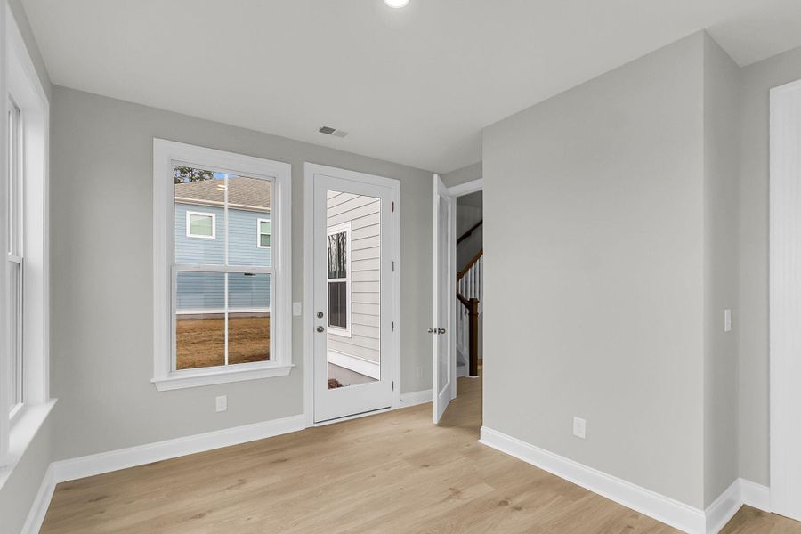 Spacious, unfurnished interior of a new home in Tidewater at Lakes of Cane Bay, Summerville (Image 20).