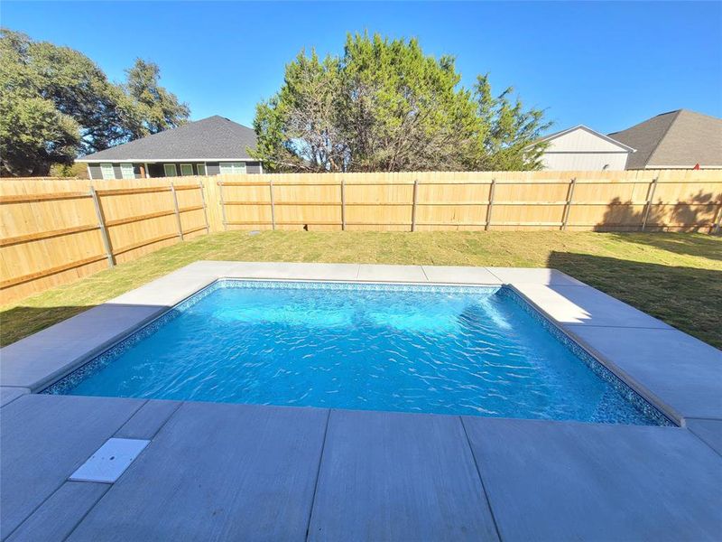 View of pool featuring a yard