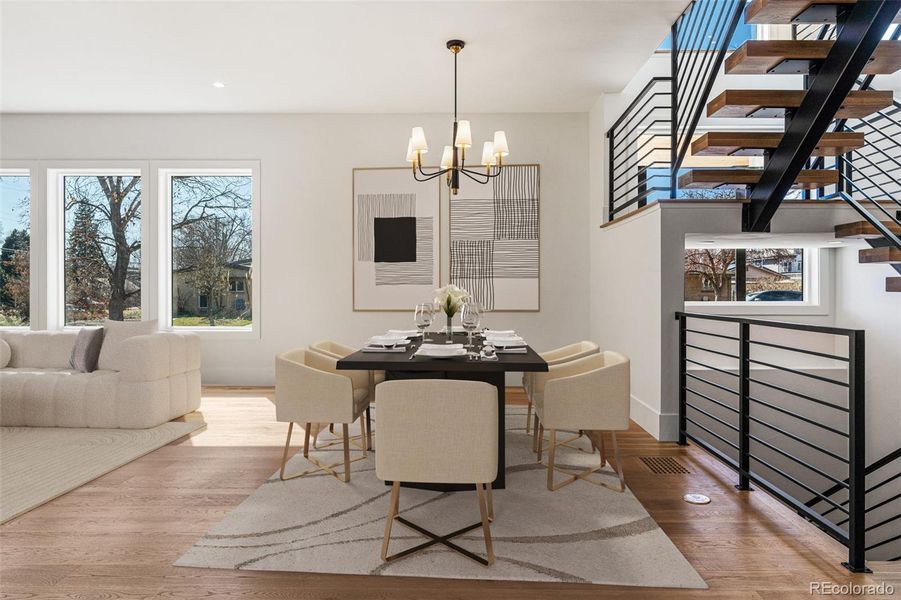 Dynamic chandelier in the Dining area that opens to kitchen and living room