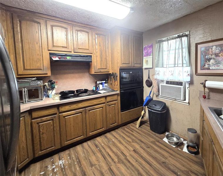 Ample cabinets, built in microwave and oven.