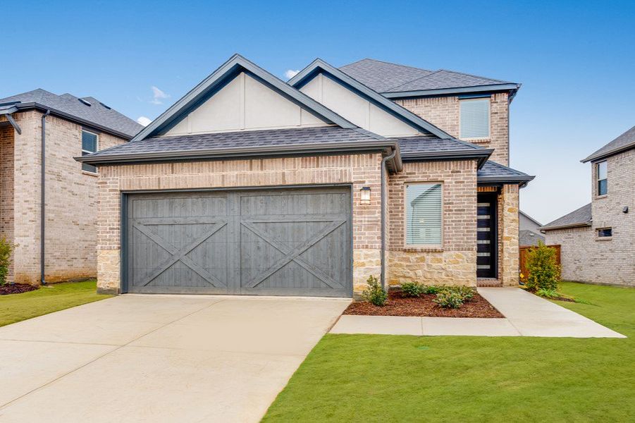 Representative exterior photo of a completed home built from the Legato by Taylor Morrison in South Oak 40s, Oak Point, TX (Image 19). Representative exterior photo of a completed home built from the Legato by Taylor Morrison in South Oak 40s, Oak Point, TX (Image 19).