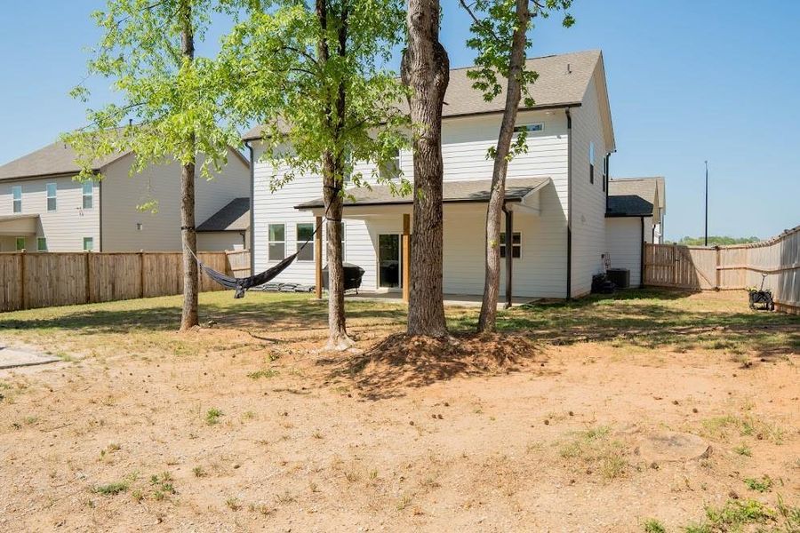 Exterior details and patio area of a home in Park at Ansleigh Farms, Dallas (Image 4).