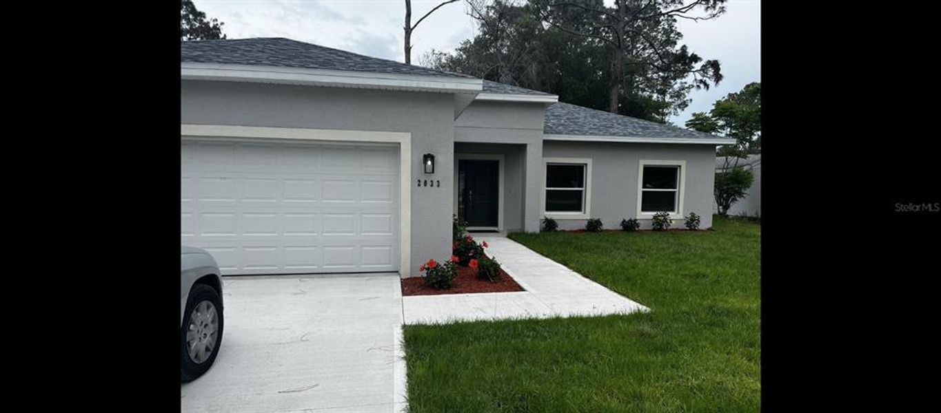 Front exterior of a new home in , Deland, FL, highlighting curb appeal (Image 21).