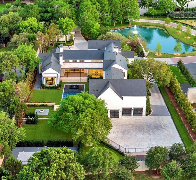 Aerial view of backyard, 4-car garage, and large motor court
