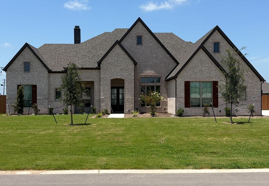 Front exterior of a new home in Lakeridge Estates, Lorena, TX, highlighting curb appeal (Image 1). Front exterior of a new home in Lakeridge Estates, Lorena, TX, highlighting curb appeal (Image 1).