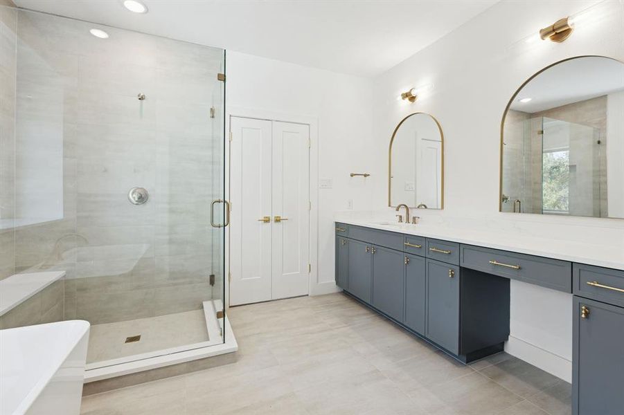 Large frameless shower with bench.