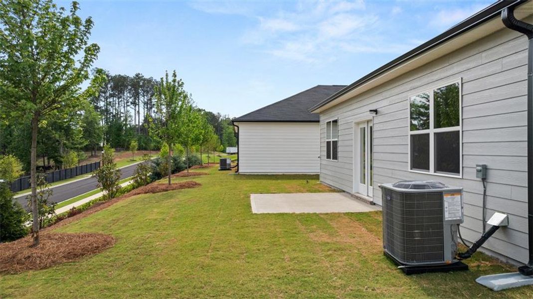 Exterior details and patio area of a home in Champion's Run, Lithonia (Image 25).
