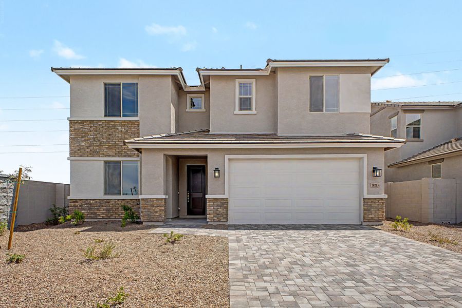 Front exterior of a new home in Citrus Park, Goodyear, AZ, highlighting curb appeal (Image 1). Front exterior of a new home in Citrus Park, Goodyear, AZ, highlighting curb appeal (Image 1).