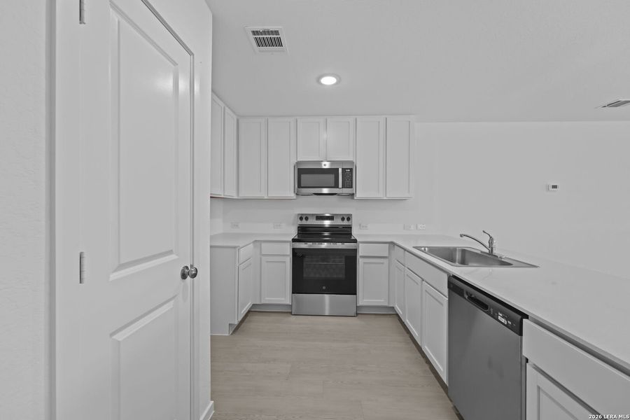 Furnished interior view inside a new home in Guadalupe Ridge, New Braunfels (Image 5).