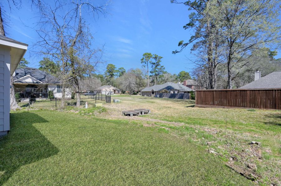 Enjoy an oversized, level backyard with plenty of room for a garden, playset, or future pool—a rare find for outdoor enthusiasts.