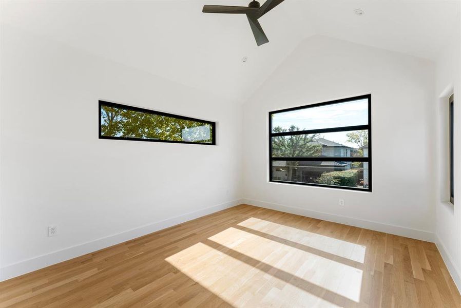 Bedroom with ceiling fan and high vaulted ceiling Bedroom with ceiling fan and high vaulted ceiling