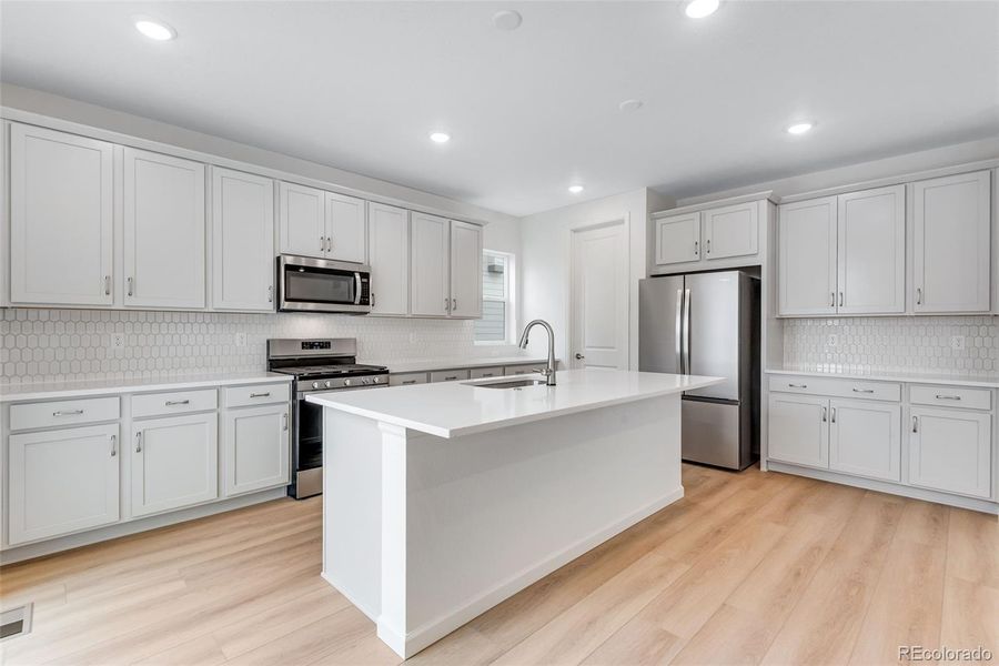 Furnished interior view inside a new home in Reunion, Commerce City (Image 14).