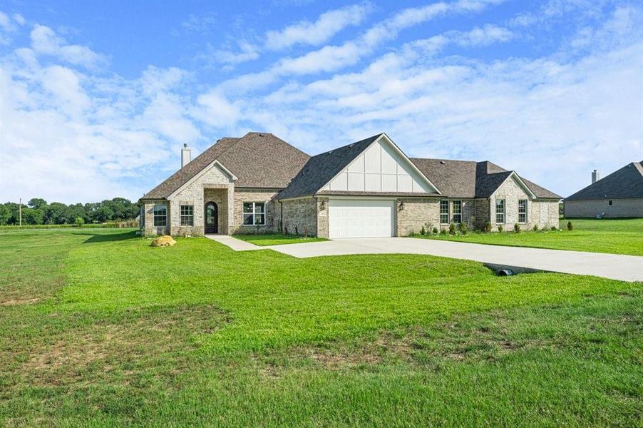 Front exterior of a new home in , Corsicana, TX, highlighting curb appeal (Image 20). Front exterior of a new home in , Corsicana, TX, highlighting curb appeal (Image 20).