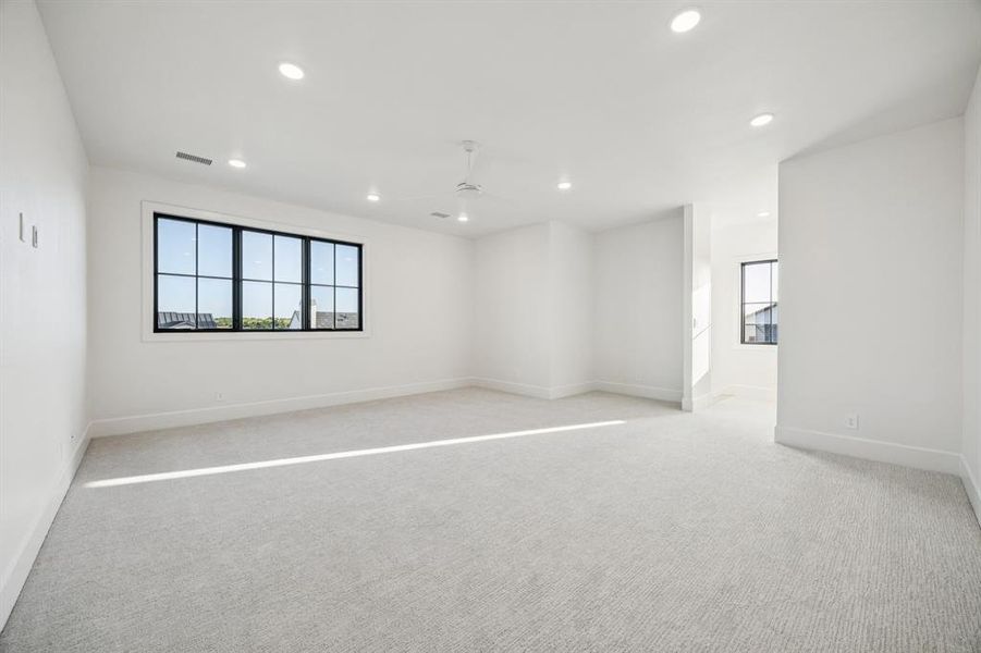 Empty room featuring recessed lighting, ceiling fan, and light colored carpet Empty room featuring recessed lighting, ceiling fan, and light colored carpet