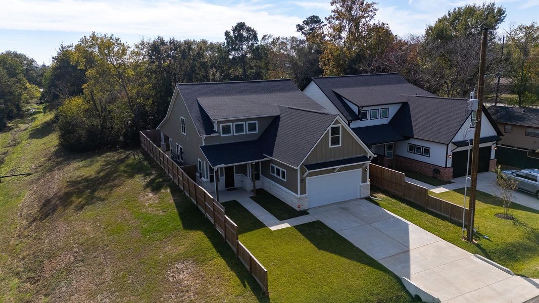 Front exterior of a new home in , Tomball, TX, highlighting curb appeal (Image 24).