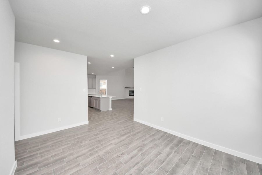 Craft enduring memories with loved ones around the table! This roomy dining area boasts stylish flooring, personalized paint, and is conveniently situated next to the family room and kitchen. Craft enduring memories with loved ones around the table! This roomy dining area boasts stylish flooring, personalized paint, and is conveniently situated next to the family room and kitchen.