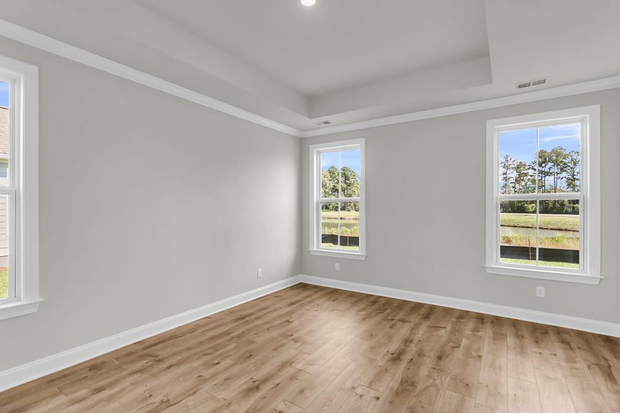 Spacious, unfurnished interior of a new home in Tidewater at Lakes of Cane Bay, Summerville (Image 23).
