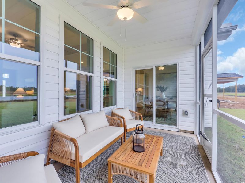 Covered Porch with a ceiling fan and an outdoor hangout area Covered Porch with a ceiling fan and an outdoor hangout area