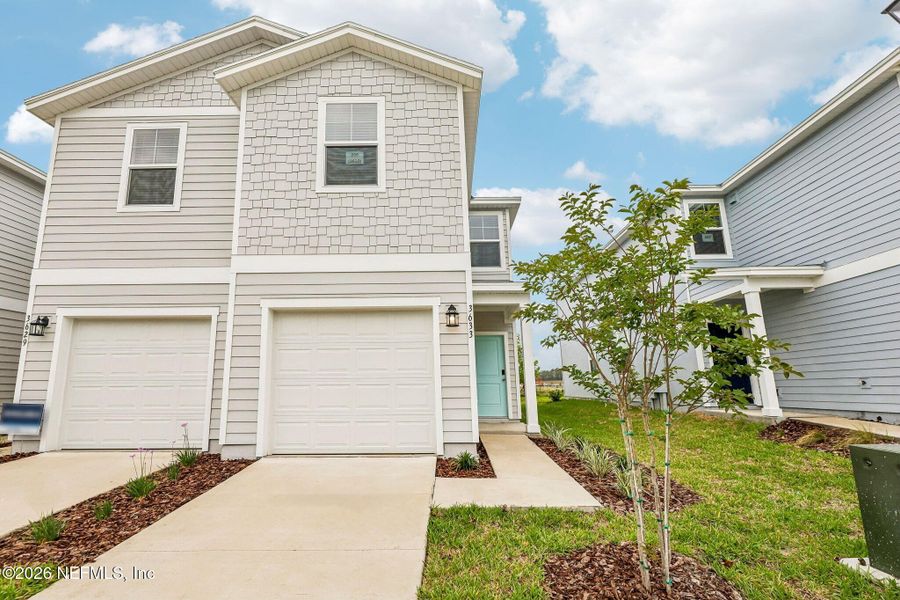 Front exterior of a new home in , Middleburg, FL, highlighting curb appeal (Image 2). Front exterior of a new home in , Middleburg, FL, highlighting curb appeal (Image 2).