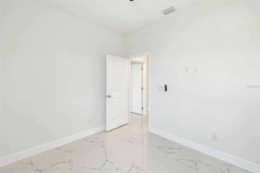 Spacious, unfurnished interior of a new home in , Port Charlotte (Image 28).