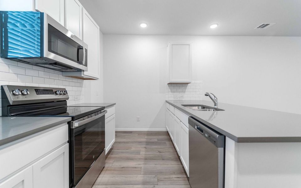Furnished interior view inside a new home in Municipal Drive Townhomes, Leander (Image 4). Furnished interior view inside a new home in Municipal Drive Townhomes, Leander (Image 4).
