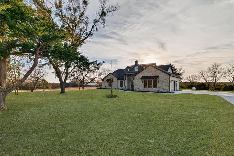 Front exterior of a new home in , Farmersville, TX, highlighting curb appeal (Image 2). Front exterior of a new home in , Farmersville, TX, highlighting curb appeal (Image 2).