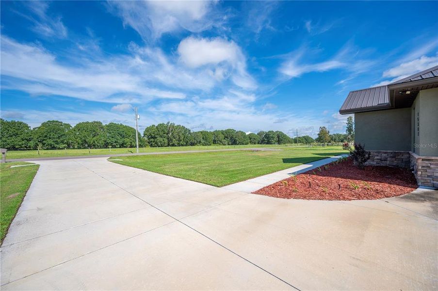 Front exterior of a new home in , Lakeland, FL, highlighting curb appeal (Image 27).