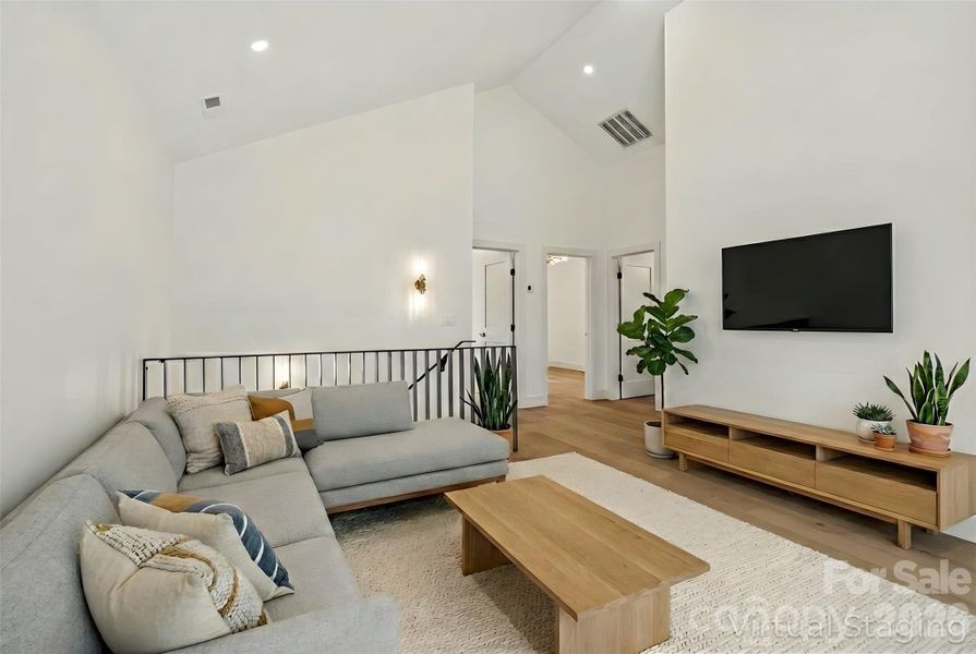 Flexible loft space ideal for media room or additional lounge area