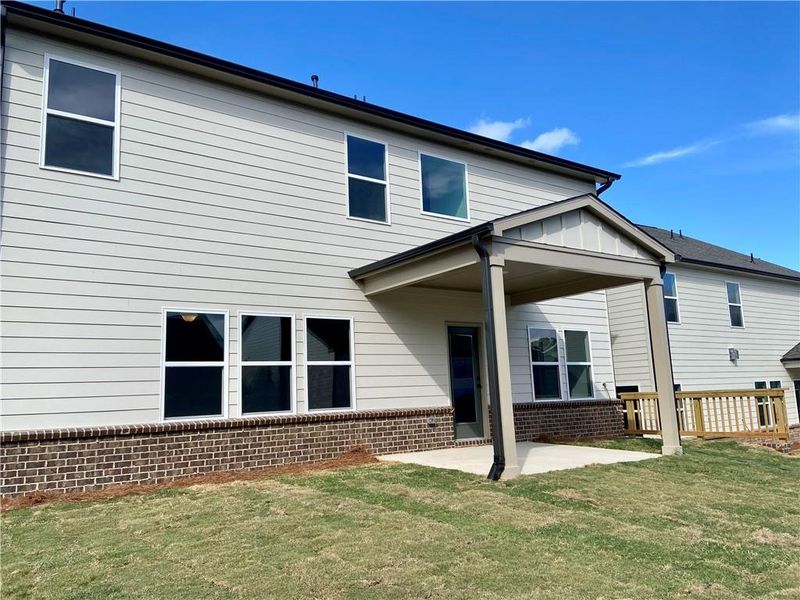 Exterior details and patio area of a home in Eastlyn Crossing, Flowery Branch (Image 4).