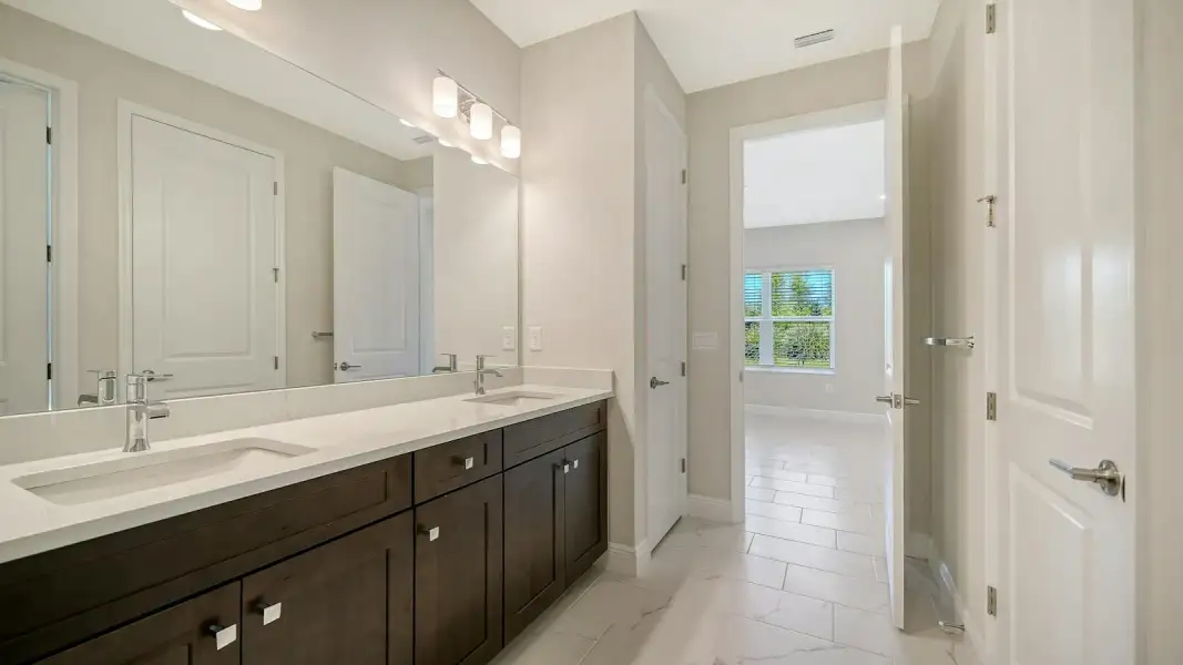 Furnished interior view inside a new home in Windward Real Estate and Homes for Sale in Sarasota, FL - Neal Communities, Sarasota (Image 16). Furnished interior view inside a new home in Windward Real Estate and Homes for Sale in Sarasota, FL - Neal Communities, Sarasota (Image 16).