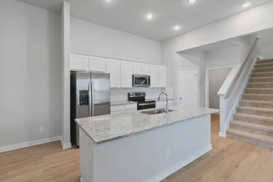 Representative furnished interior of a home built from the Duplex 1676 by TwoTen Communities in Amanda Park, San Antonio (Image 8).
