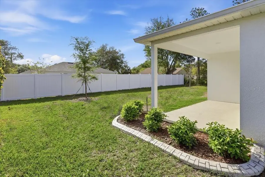 Exterior details and patio area of a home in Aspire at Palm Coast, Palm Coast (Image 4).