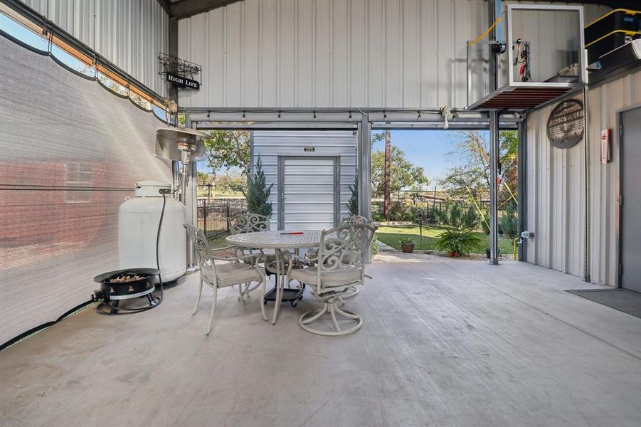Looking out to the man cave/storage building. Looking out to the man cave/storage building.