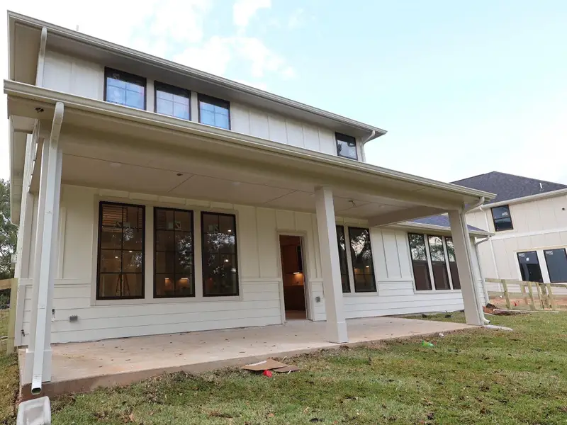 Exterior details and patio area of a home in The Oaks on 6th Street, Magnolia (Image 3). Exterior details and patio area of a home in The Oaks on 6th Street, Magnolia (Image 3).